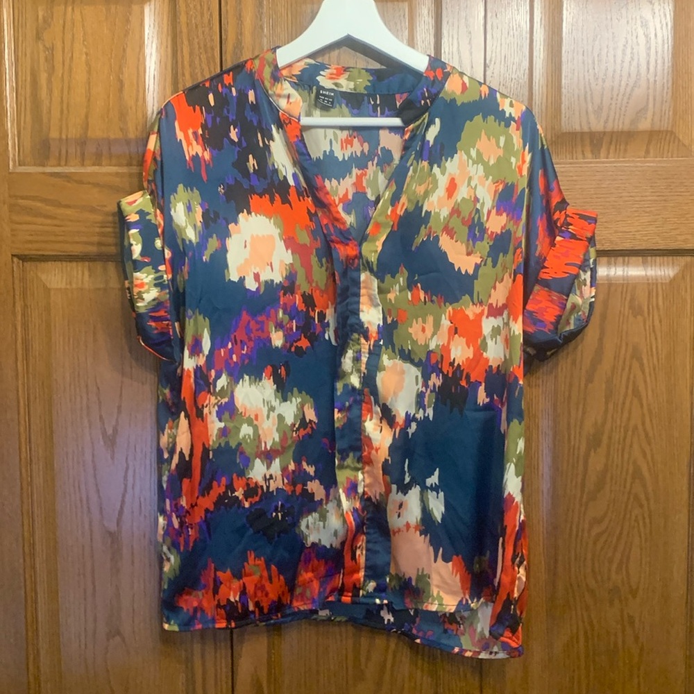 Ladies size Medium gently worn abstract floral top